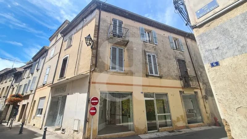 Grand immeuble composé d'un local et de plusieurs appartements - Photo 1