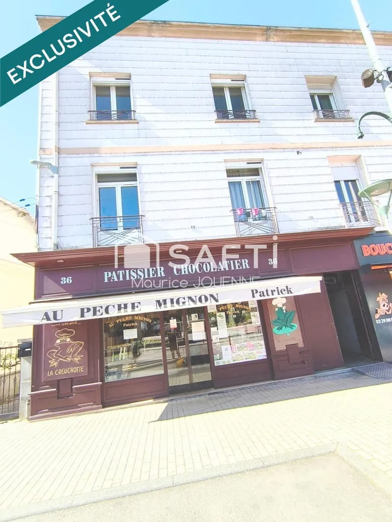 Coeur de VITTEL, bel immeuble mixte incluant un commerce pâtissier, chocolatier et 2 appartements loués - Photo 1